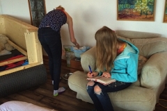 23-01. Girls weighing puppies 1